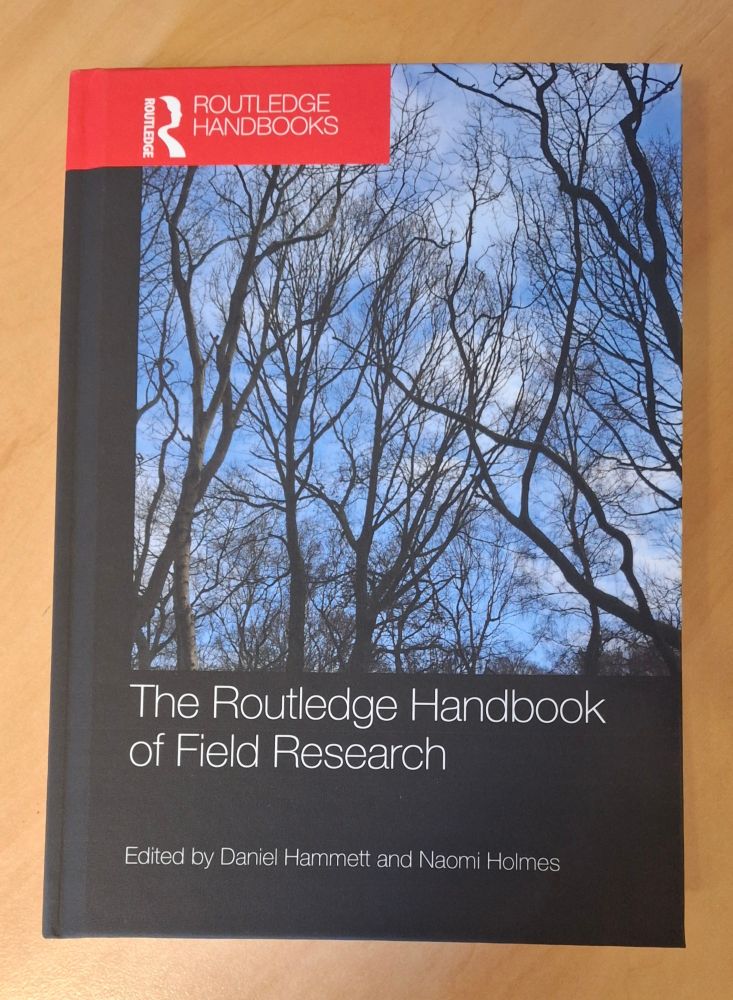 Photo of a new book, 'The Routledge Handbook of Field Research', edited by Daniel Hammett and Naomi Holmes