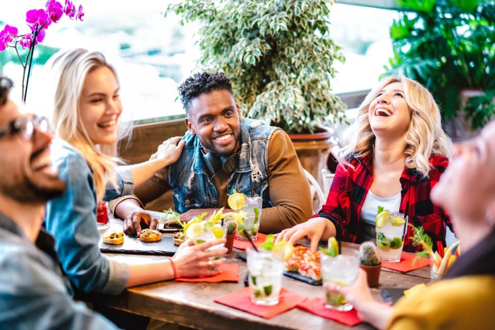 Young people eating out together