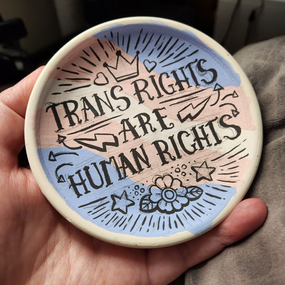 Unfinished tray, not fired yet and no black rim. Background and text are completed.