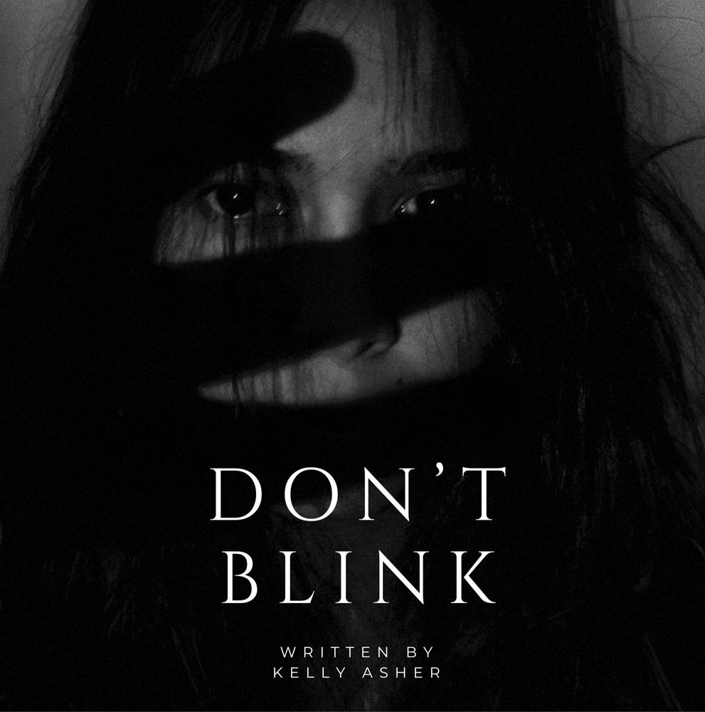 Black and white photo of a girl with a shadowy hand over her face.
Don't Blink
Written by Kelly Asher