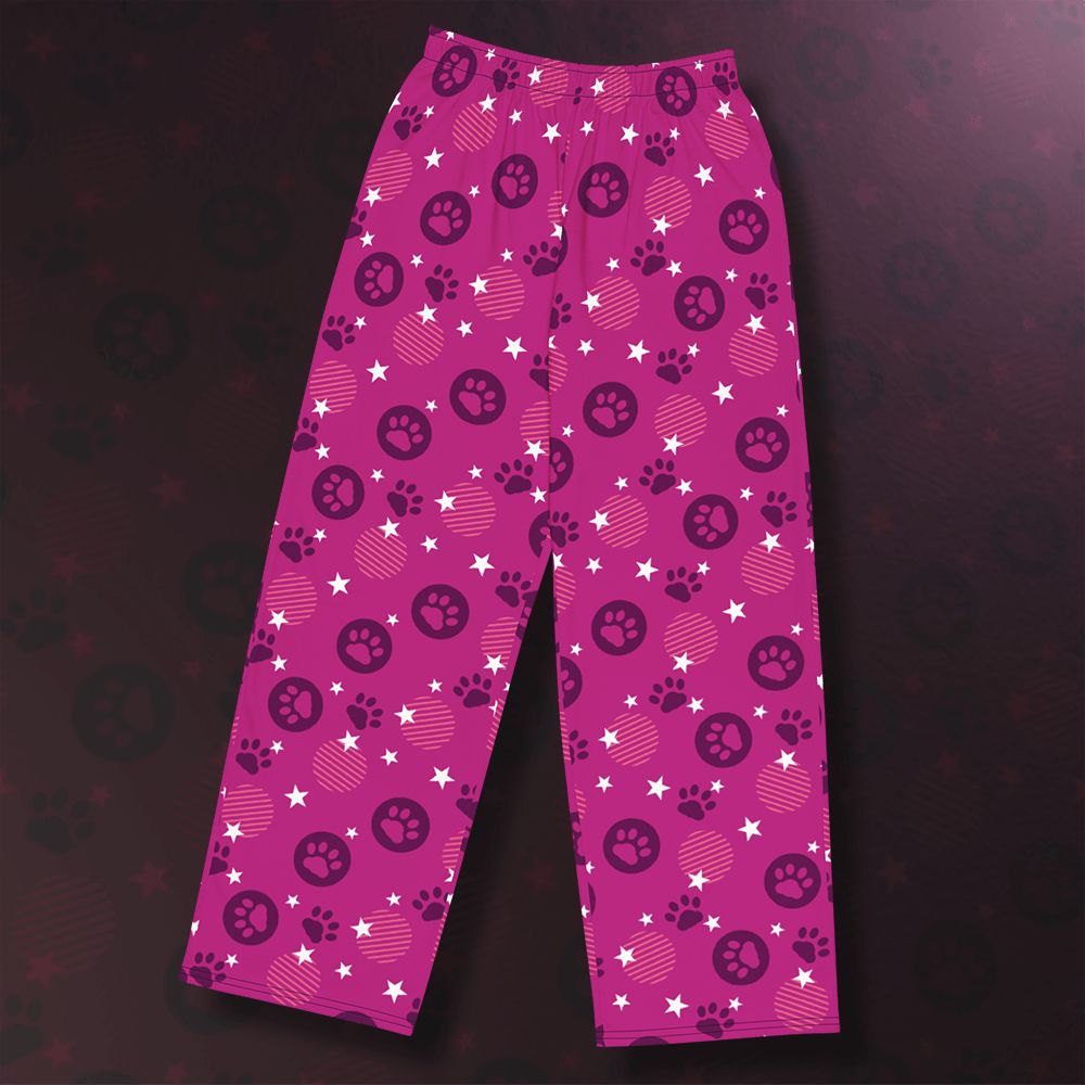 a pair of bright pink pants covered in paw prints and stars