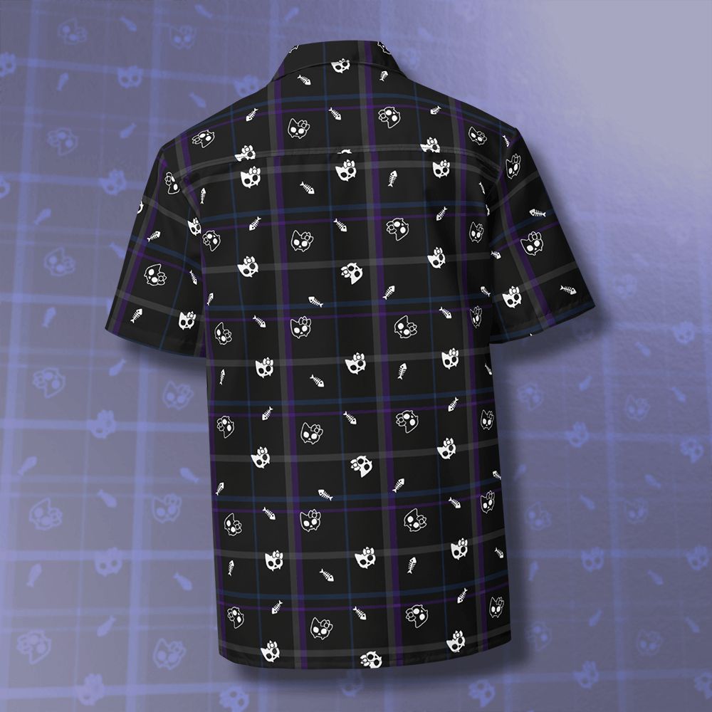 the back of a shirt with multiple cat skulls and fish bones on a plaid background