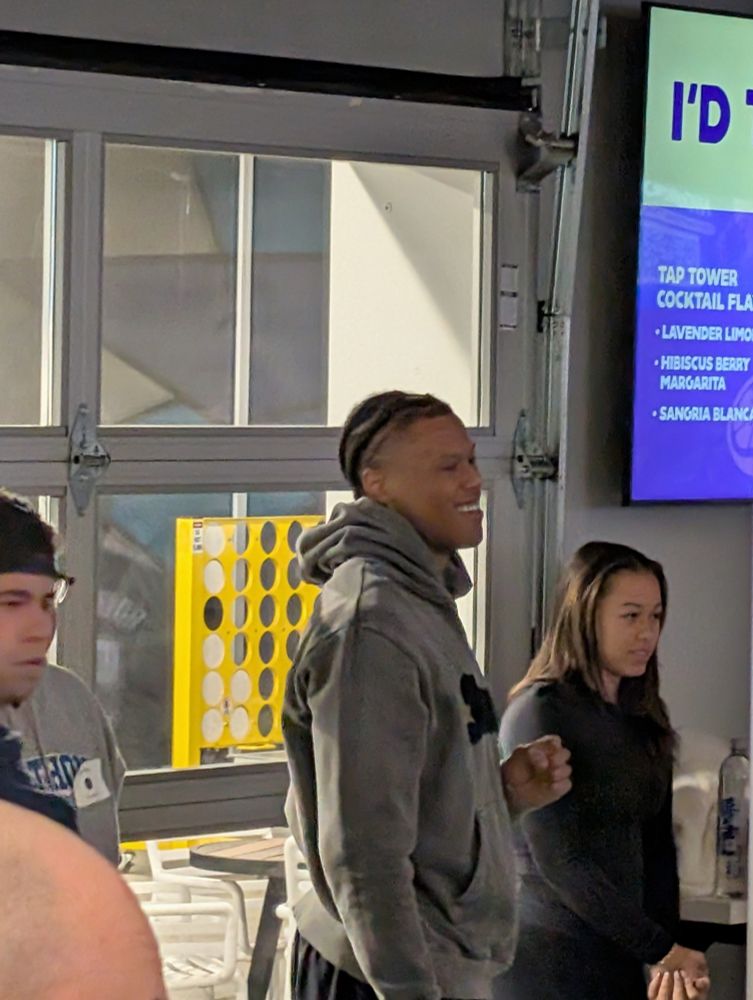 Jaylen Clark playing corn hole 