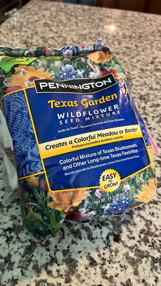 A bag of pennington texas garden wildflower mix on a granite counter