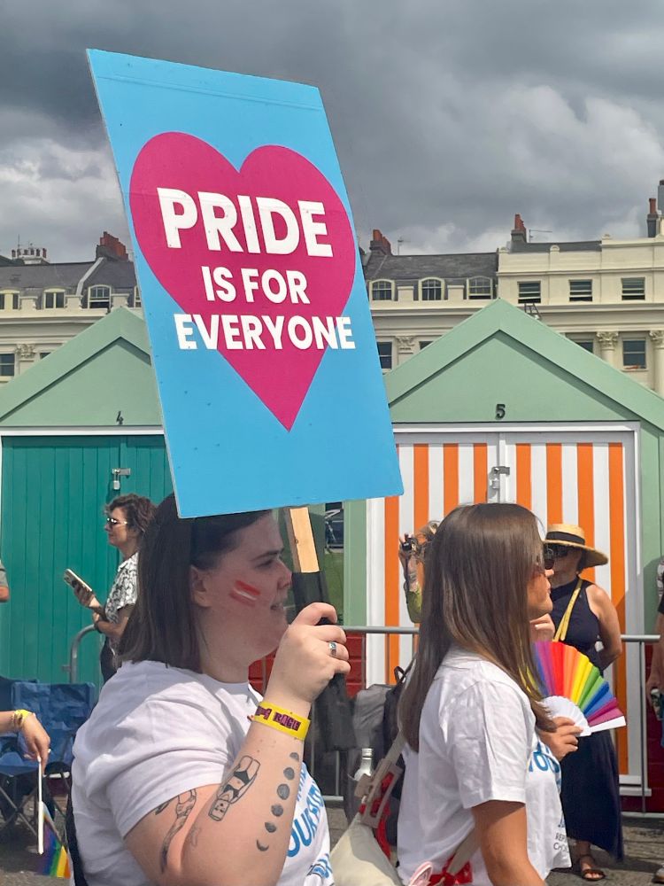 Brighton Pride Parade - participant carrying a sign saying ‘Pride is for everyone’.