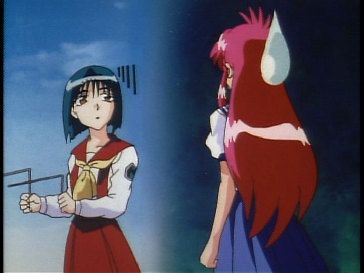 The occult fanatic with her divining rods

The screenshot shows a dark-haired girl holding divining rods and looking at a pink haired girl who is shrouded in darkness and has a large cartoony sweatdrop on the back of her head