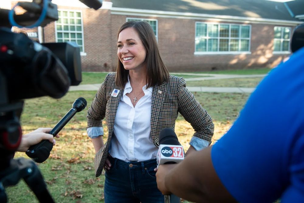 Senator Katie Britt wearing a cross. 
