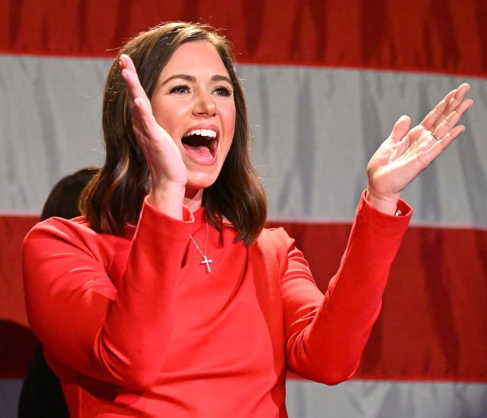 Senator Katie Britt wearing a cross. 