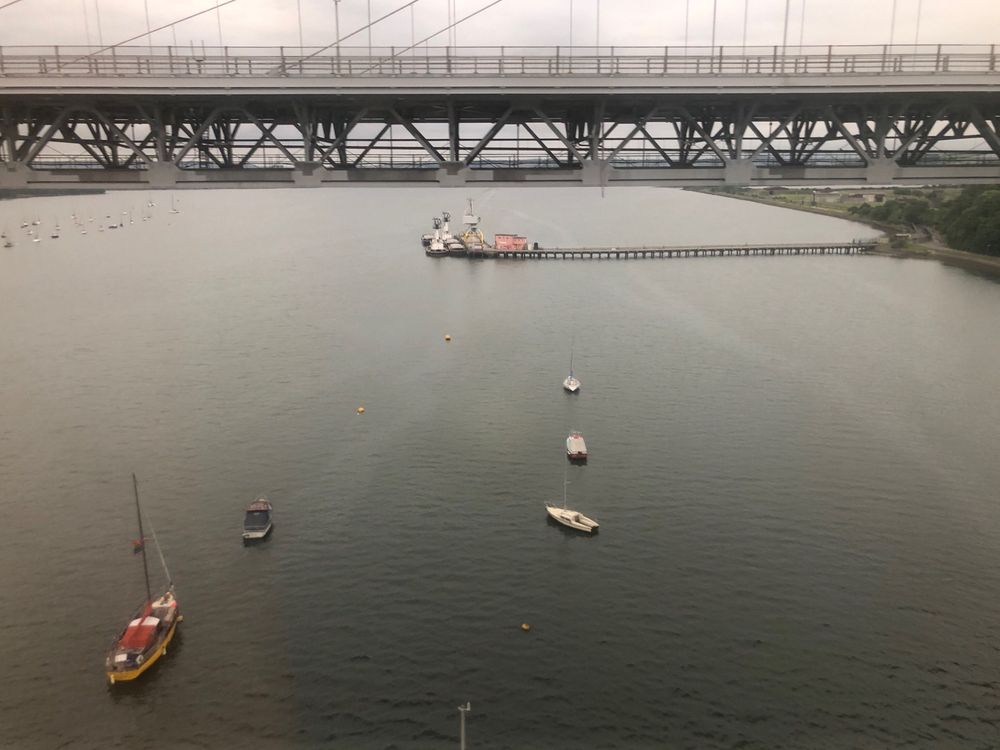  View of the river Tamar and small boats with car bridge in the background 
