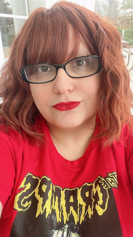 I am wearing a red t-shirt with yellow and black letter of my favorite band The Cramps