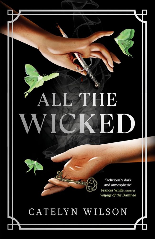 The cover for ALL THE WICKED by Catelyn Wilson. Two graceful hands are mirroring each other against a black background. One hand is on the top part of the book and has a sharp dagger going through the middle of the palm (ouch) with some blood coming from the wound. The other hand is on the bottom part of the cover and holds an elaborate bronze key. Three luna moths of various poses encircle the hands.