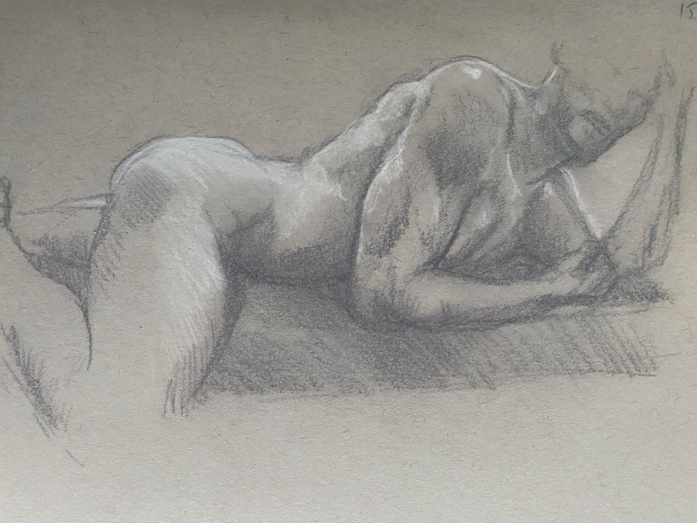 Black and white sketch of a muscular figure lying on his front, shown from the side.