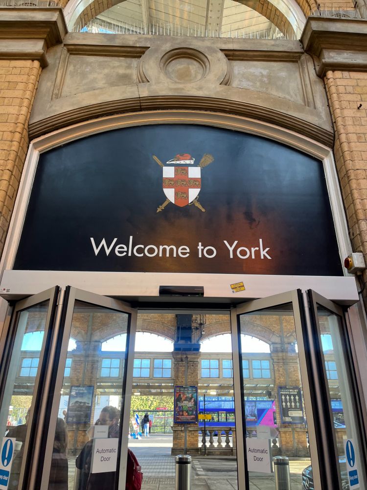 A photograph of the doors in York train station which says 'Welcome to York.