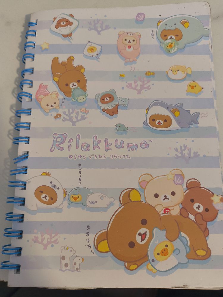 Hand-size ringed ruled notebook with Rilakkuma (a Hello Kitt teddy bear) on it, with friends, dressed in a variety of nautical costumes including a seal, an octopus, a ray, and a shark. The contents of the notebook are primarily proofs related to the Generalized Method of Moments, and some derivations about Sobolev spaces.