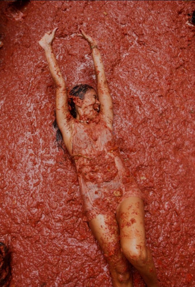 Revellers play in tomato pulp during the annual ‘La Tomatina’ food fight festival in Bunol, near Valencia, Spain, August 27, 2025.