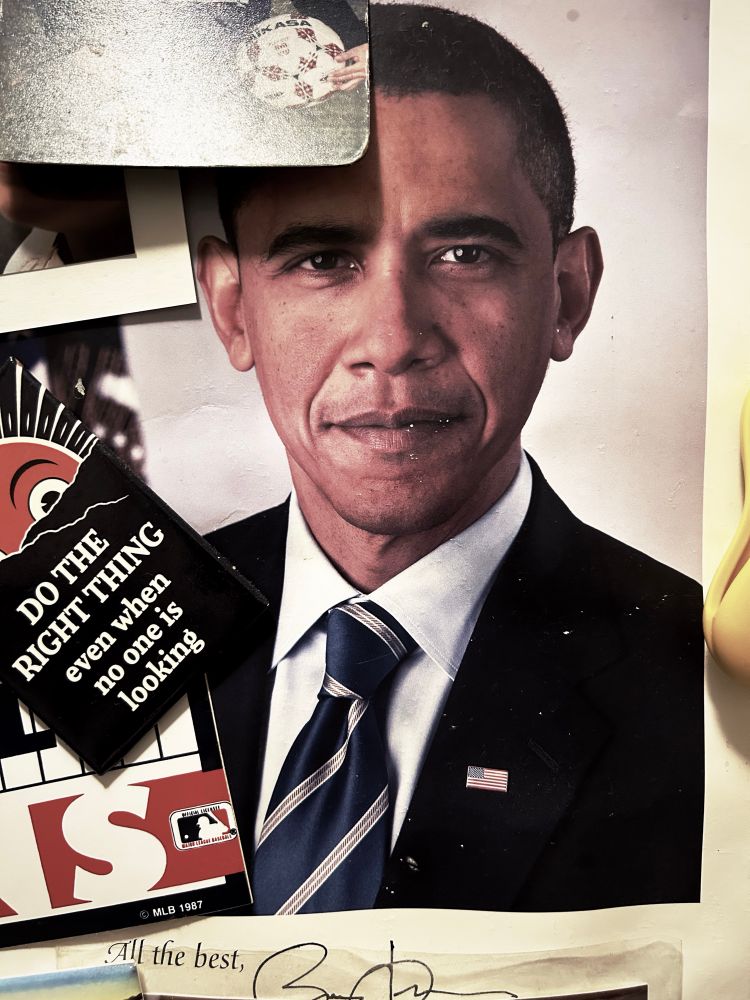 Photo of a refrigerator with a picture of President Obama on it.