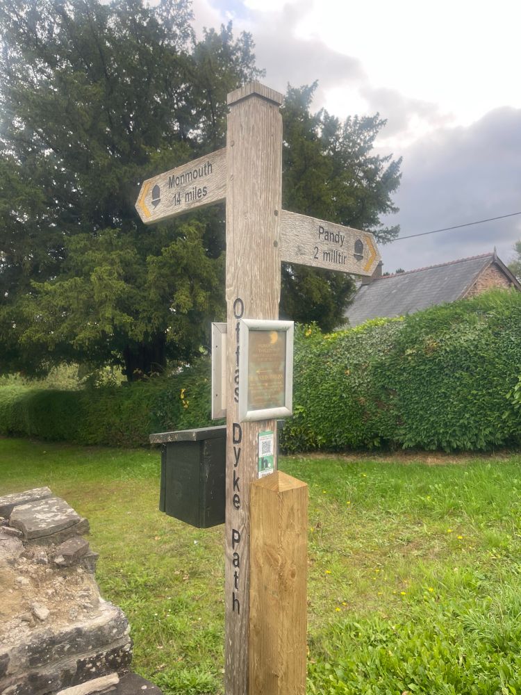 Nearing the end of the day! Signpost showing Monmouth and Pandy. 