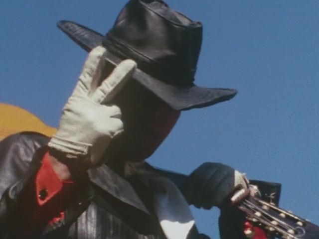 Ken Hayakawa from The Magnificent Zubat in the pose he does when telling someone that the are only the 2nd best in Japan.