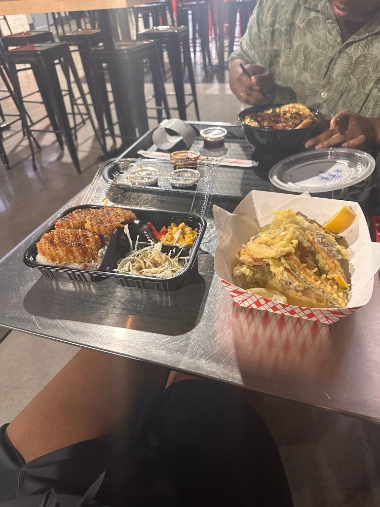 Vegetable croquette tonkatsu over rice, fried tempura vegetables, and katsudon from Alley 51 served in to go containers 