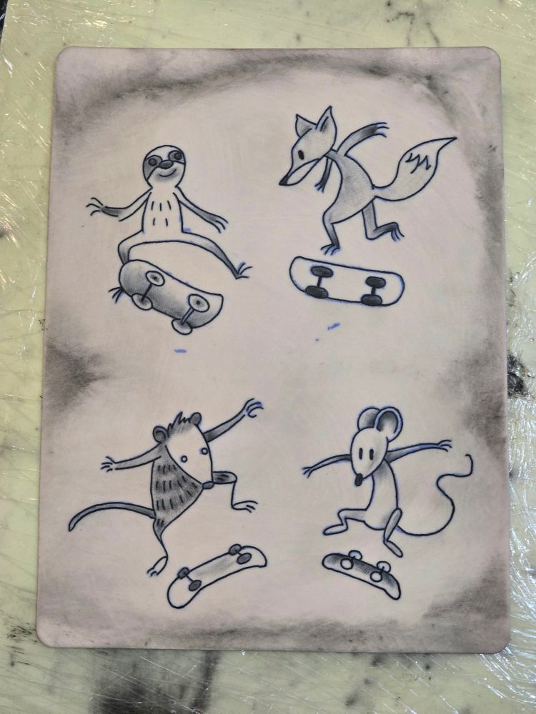 Practice tattoos of skateboarding critters on fake skin.