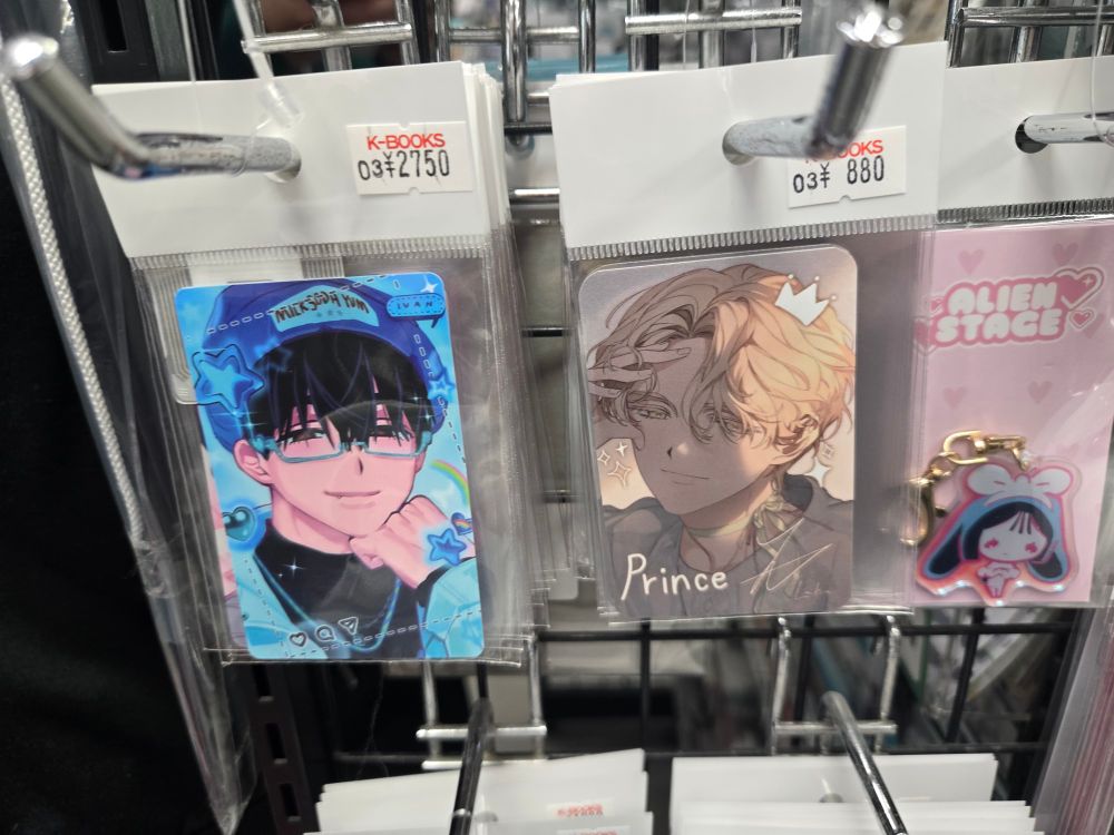 Two photo cards of alien stage characters. Ivan on the left cost 2750 yen and Luka on the right cost 880 yen