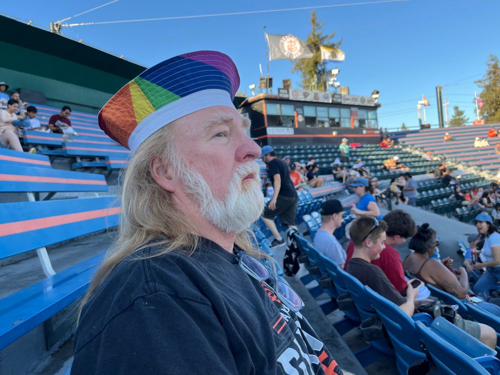 Ginger in a rainbow bucket hat. 