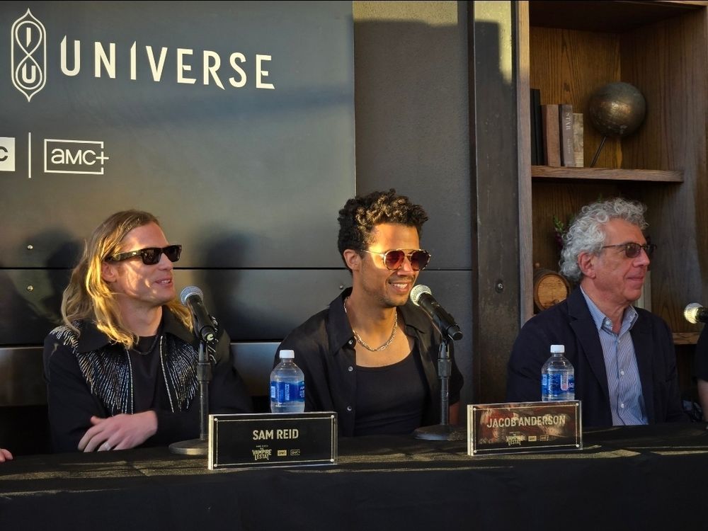 Sam Reid, Jacob Anderson, and Eric Bogosian in sunglasses and golden hour sunlight at the SDCC press conference for The Vampire Lestat