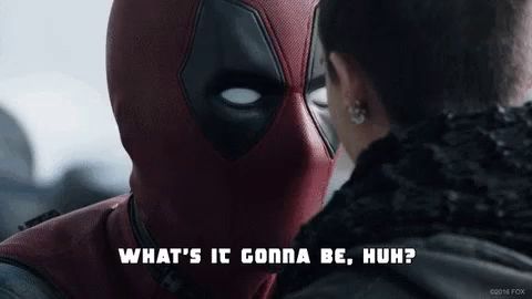 a man in a deadpool costume talks to a woman