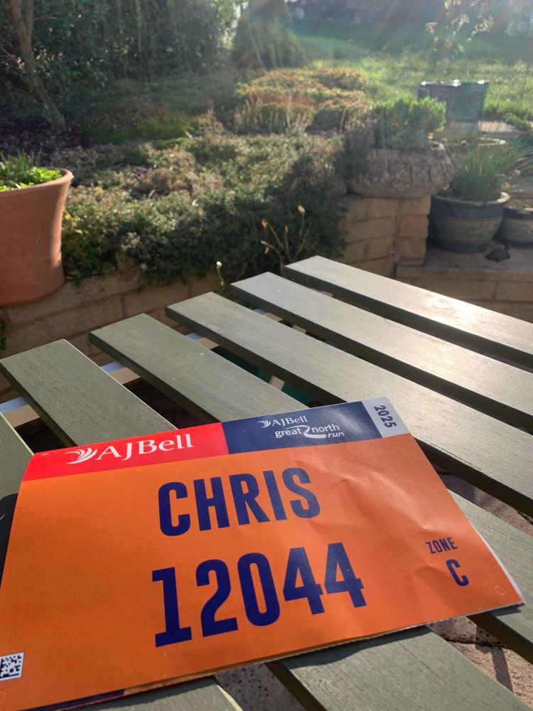 Photo of my Great North Run number, on a table in a garden 