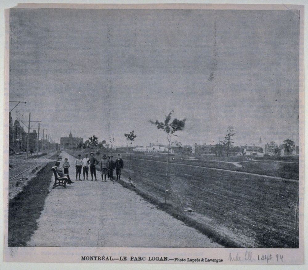 What is now Émile-Duploye in La Fontaine Park from 1894, with the tram on true left, and young trees on the right, and group of kids in the centre