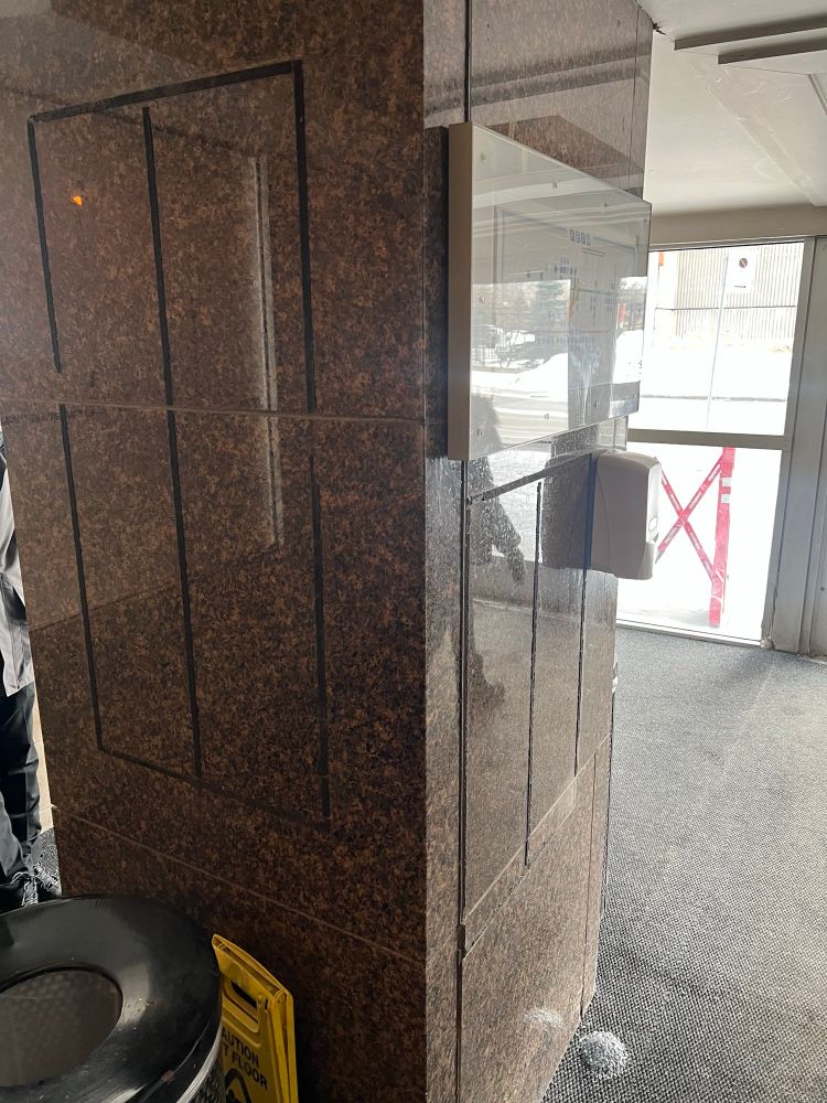 Pillar that once had signs pointing to metro, buses, street, REM and exo trains