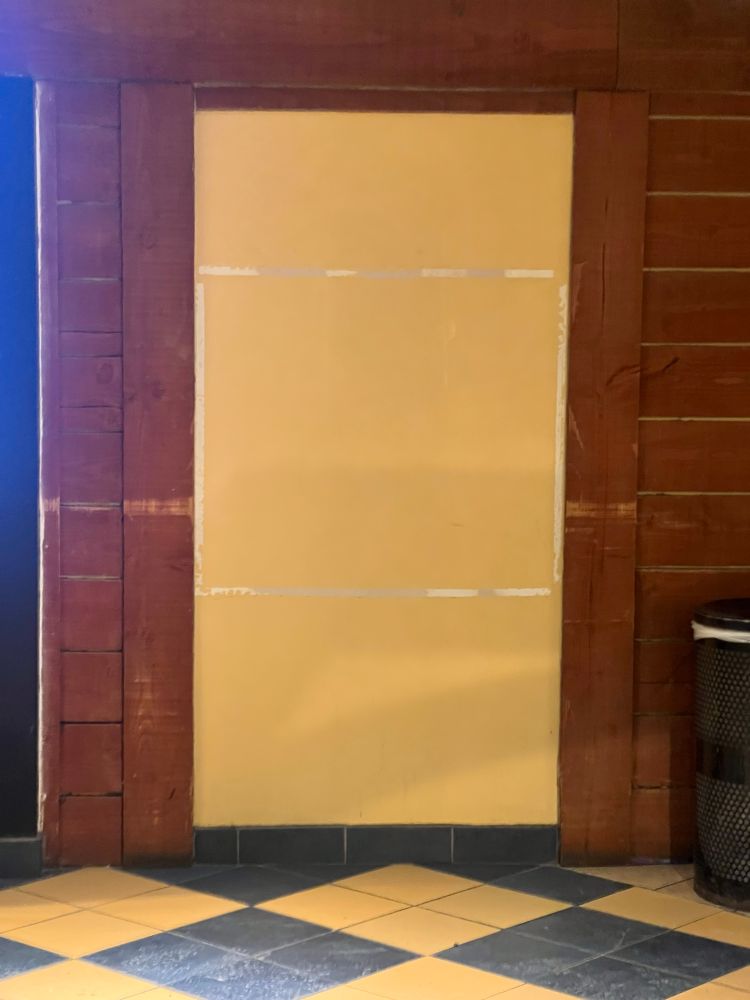 False door with outline of torn off Velcro of my sign no longer there 