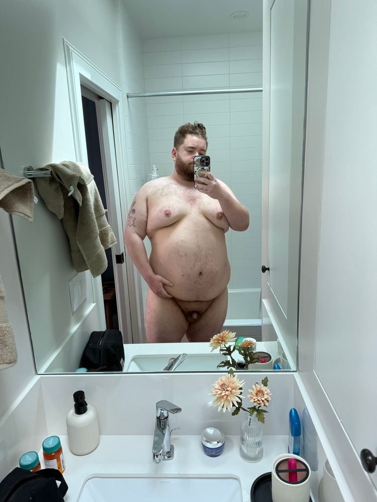 Picture of myself naked standing in a bathroom mirror. Large white bear showing bare chest belly arms legs and flaccid cock 