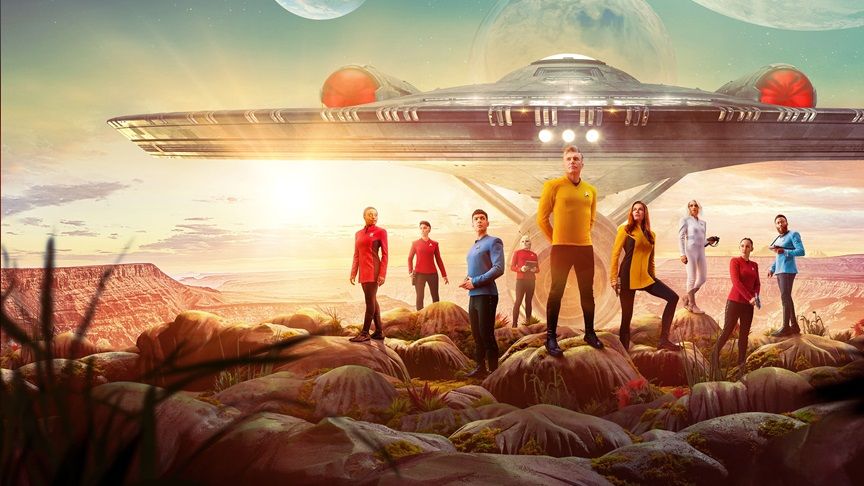 The crew of the USS Enterprise stand before their ship on the surface of an alien planet.