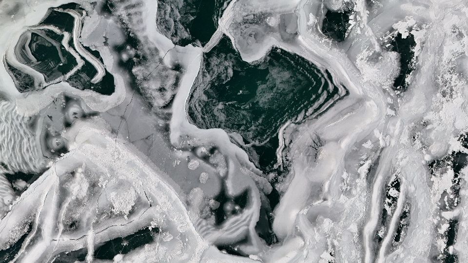 An overhead drone shot of a frozen Lake Michigan in February 2025. 