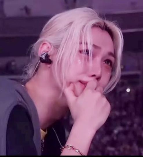 Lee Felix of stray kids crying on stage