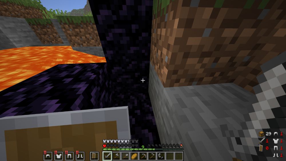 A screenshot of minecraft showing my character with 1 heart, 1 hunger, full iron armor on 1 durability, a shield on 0 durability, and full stone tools on 1 durability, a flint and steel on 1 durability, and a single piece of bread. I am standing in an unlit nether portal, presumably about to light it.