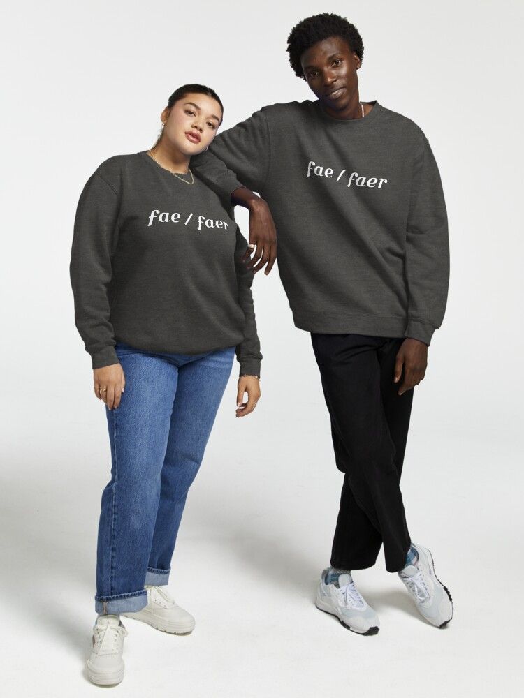 a photo of two models posing while wearing Cres' fae / faer shirts that they designed, a mockup image from Redbubble's stock photos for creators
