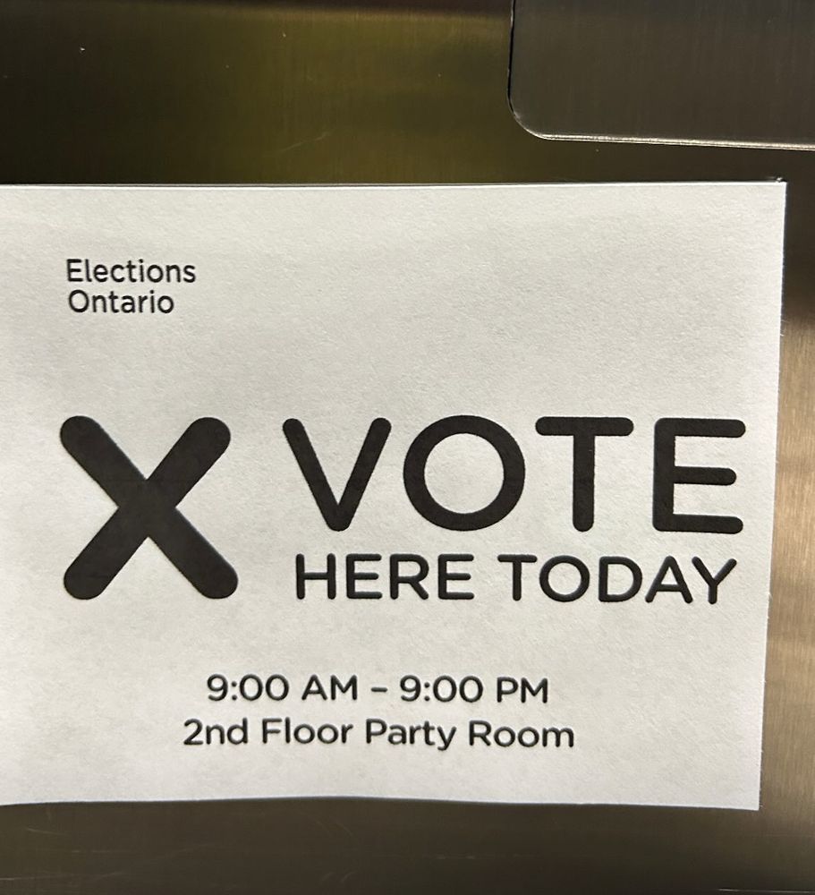 Sign says vote here today- Toronto Canada location 