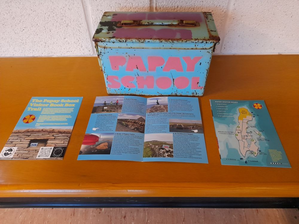 Another view of the Papay School Visitor Book Box Trail leaflet, along with one of the famous blue boxes.