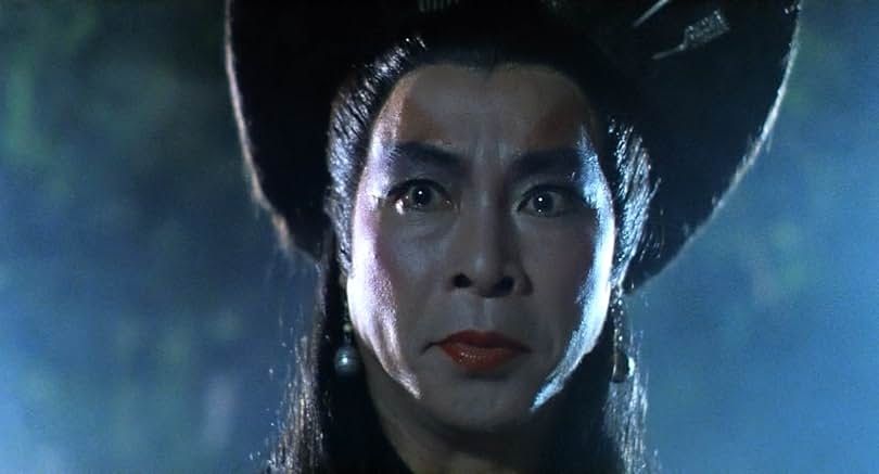 Closeup of man in makeup, during a foggy night, looking angry/scary