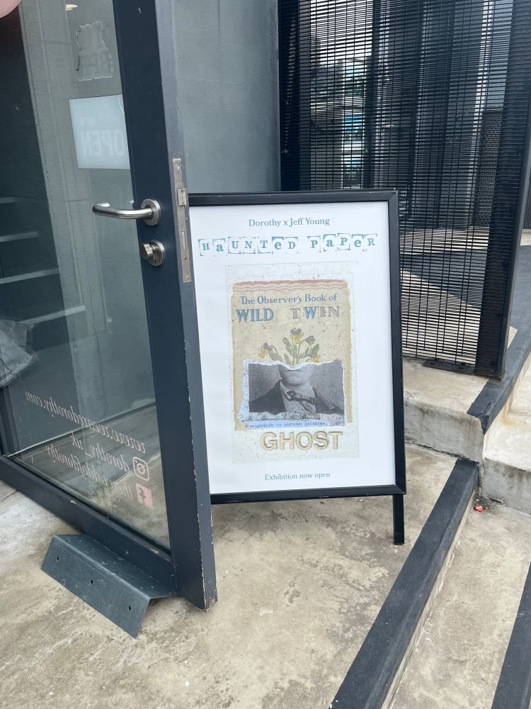 Image shows a board outside Dorothy studios in Liverpool. The poster is a collage from the Haunted Paper exhibition, an altered Observer’s book 