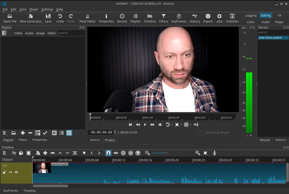 Screenshot of video editing software. The timeline contains one item, the preview for which is the first frame of a video: me, against a black background, with a microphone in the foreground, scowling at my screen.