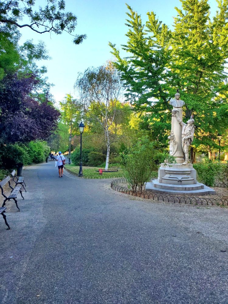 Park path with statue in foreground