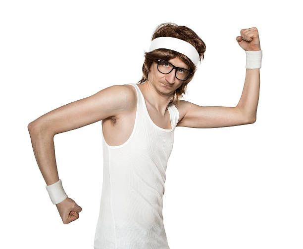 A very skinny fellow attempting to flex his quite slim arms. Welcome to the gun show here. 
