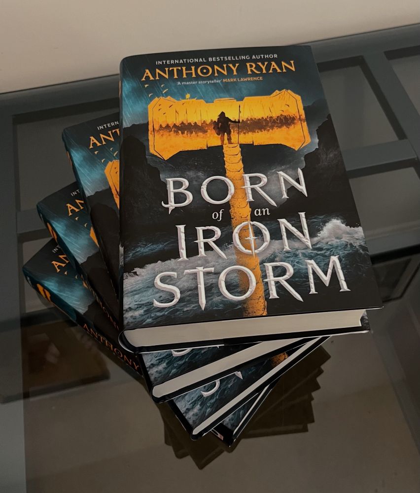 Stack of books - hardcovers of ‘Born of an Iron Storm’ by Anthony Ryan 