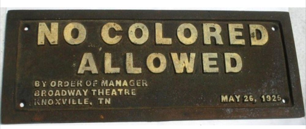Historic metal sign from Jim Crow era that reads "No Coloreds allowed by order of manager Broadway theater Knoxville Tennessee  may 26th 1925"