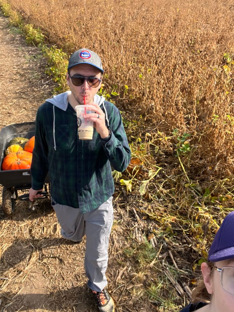 Husbands is walking behind me drinking a coffee and hauling a wagon of pumpkins.