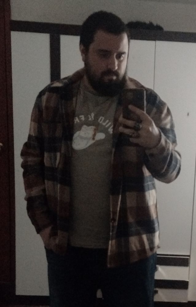 Photo of a homosexual with its familiar sleeping on top of the wardrobe.