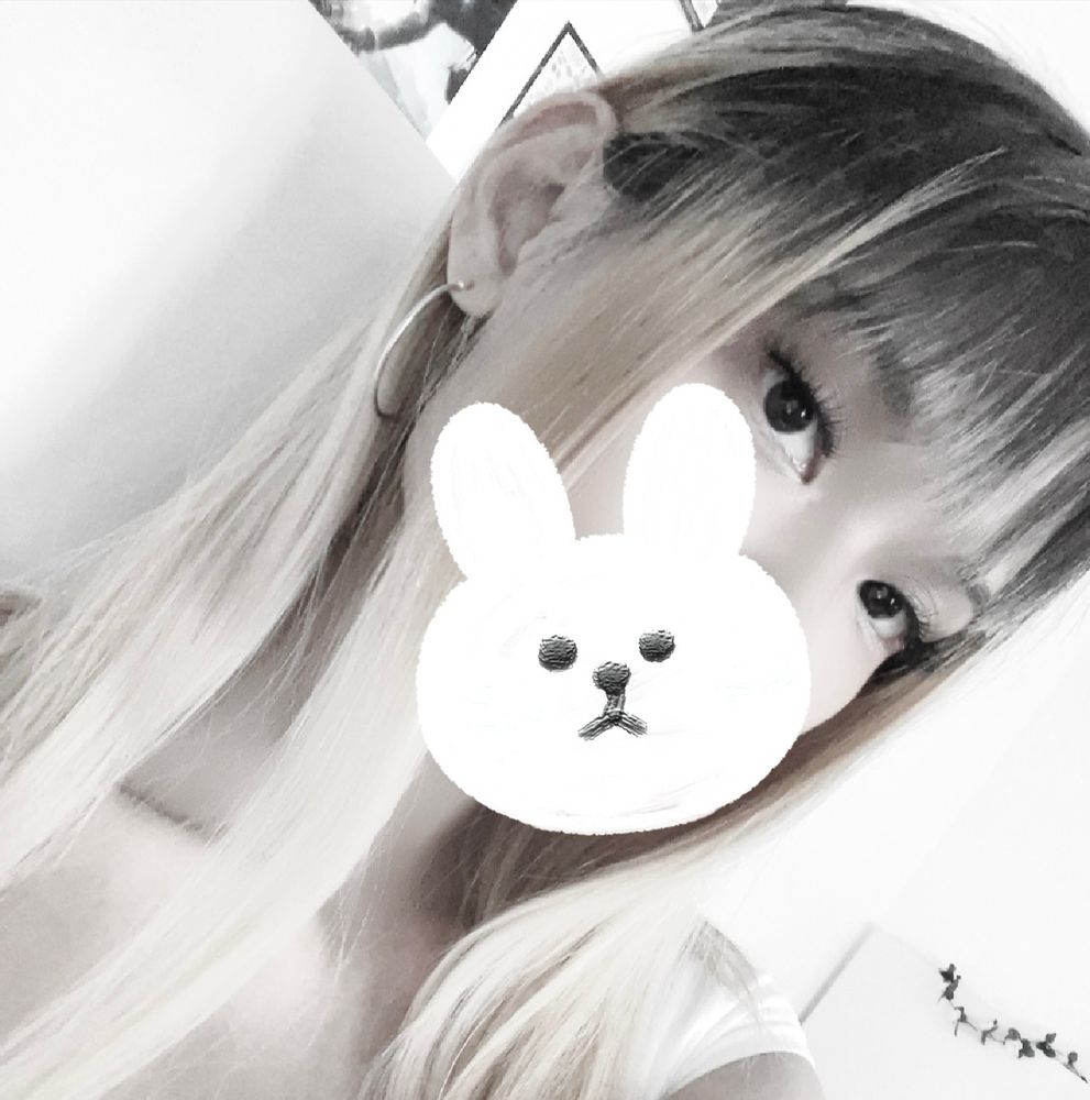 a photo of me. a notable feature of my appearance includes blonde hair with dark roots. a bunny sticker is covering the lower half of my face.